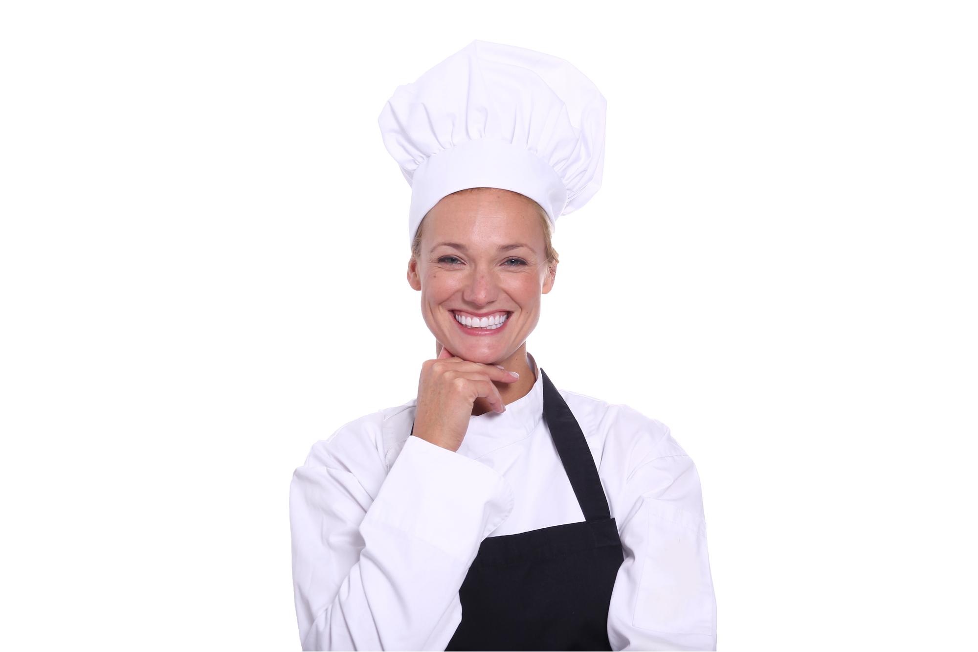 Head chef smiling in kitchen